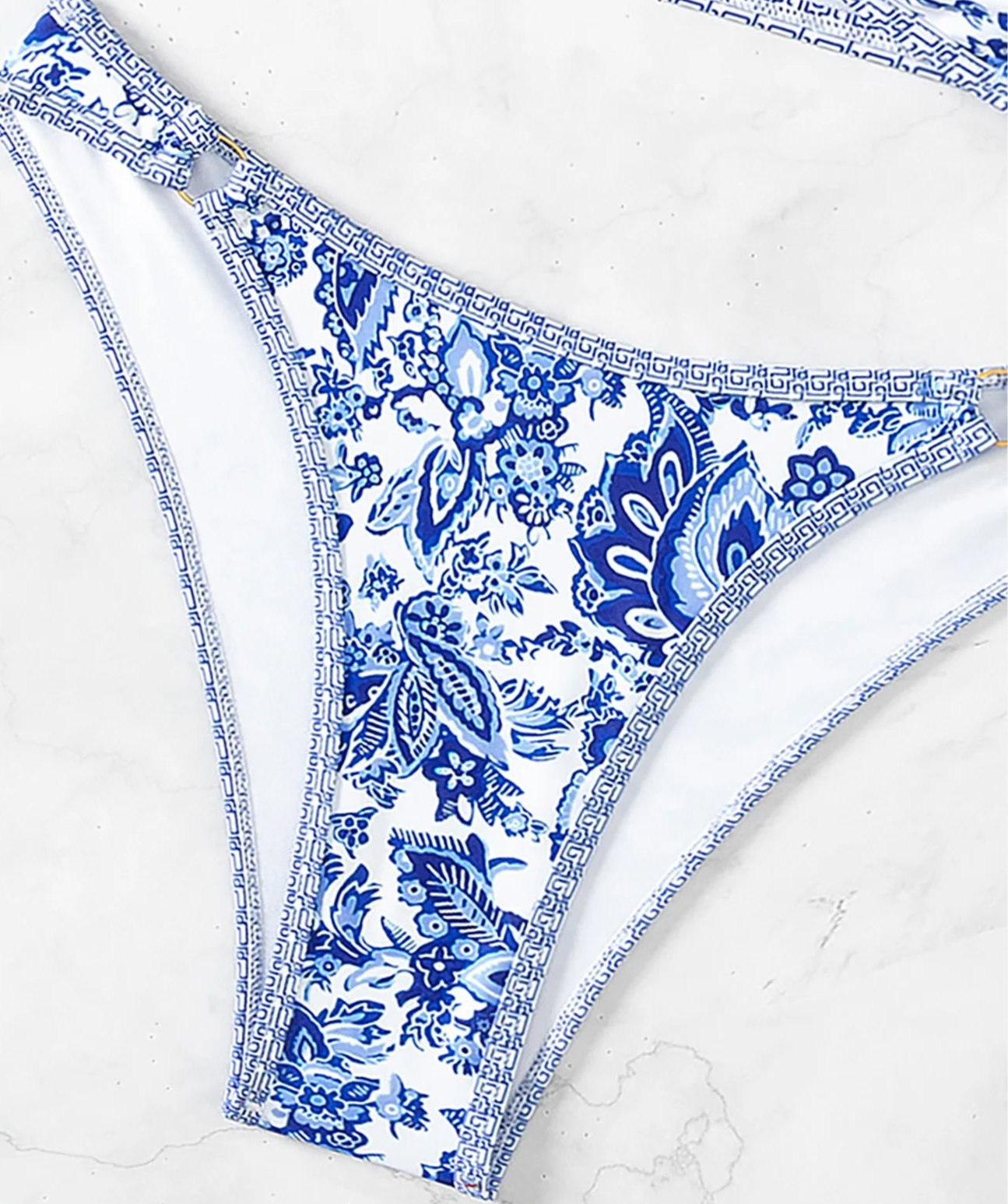 Bikini bottom featuring a blue floral print with intricate patterns | SuzzaneMarket