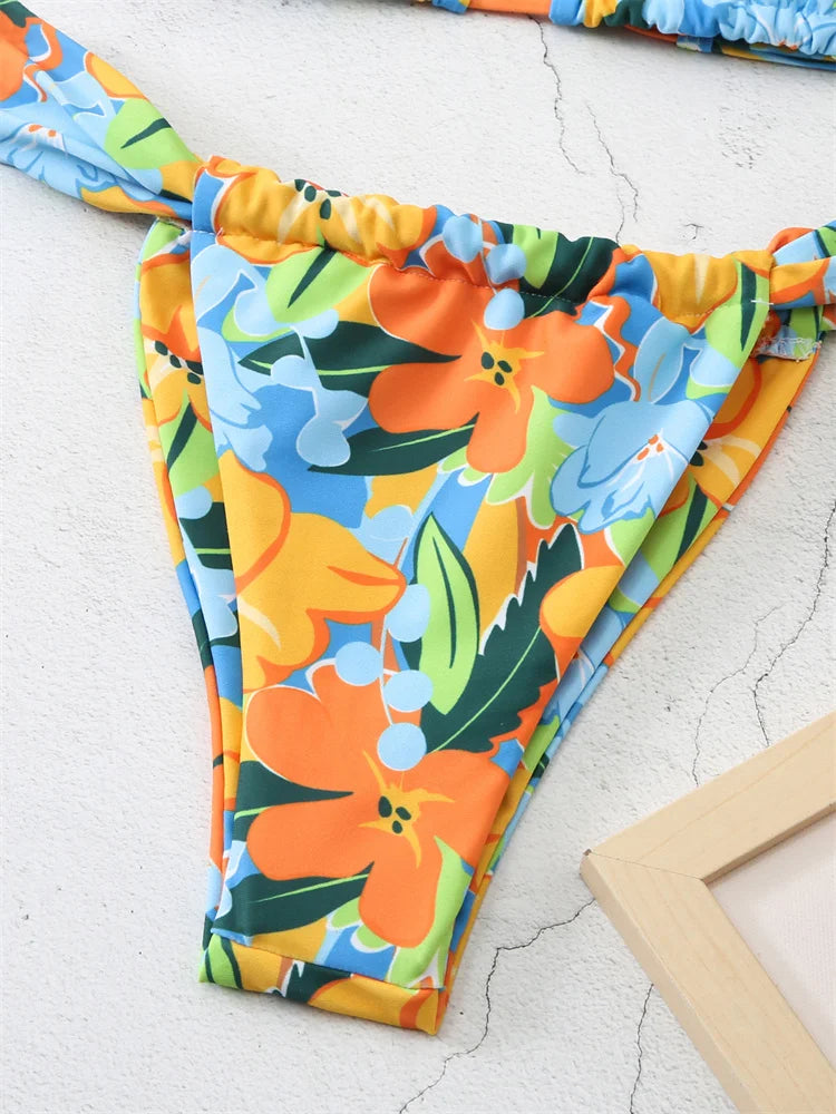 Mini Brésilien Tanga with colorful floral print, featuring a very high-cut design. Ideal for summer wear | SuzzaneMarket.