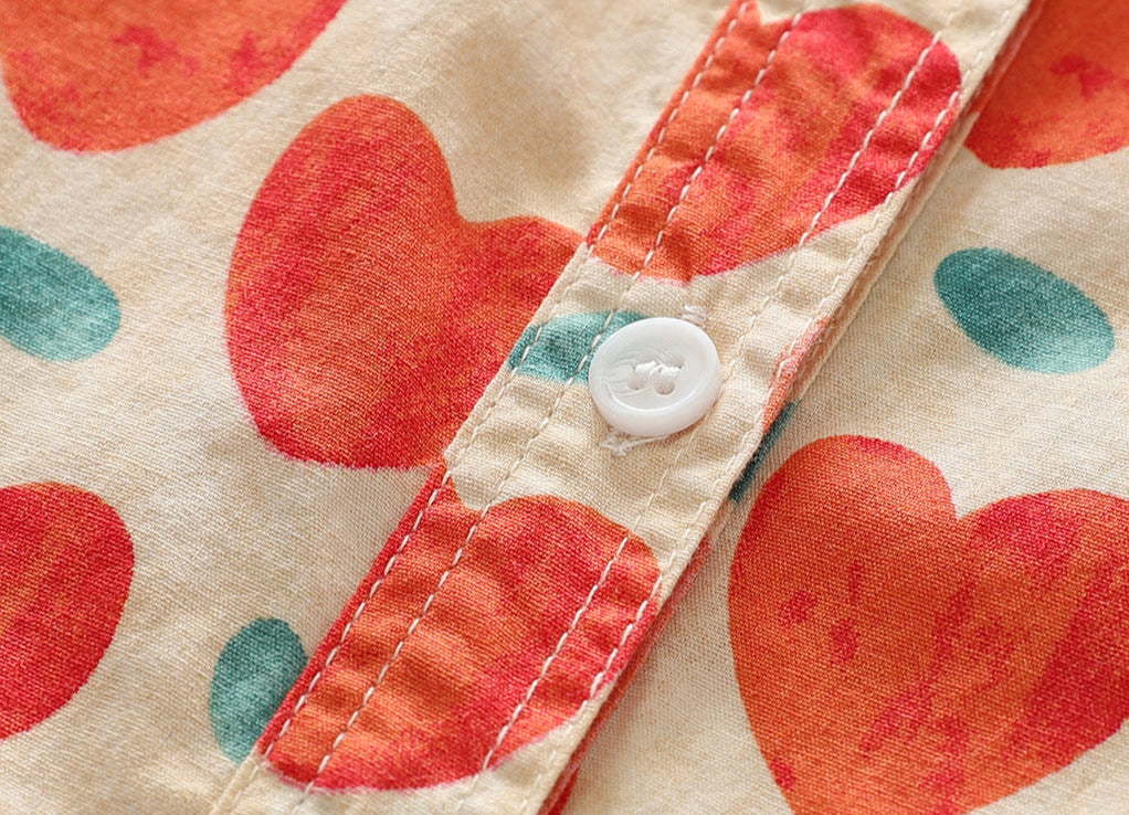 Close-up of Chemise Coton Batik showing button detail and colorful print | SuzzaneMarket