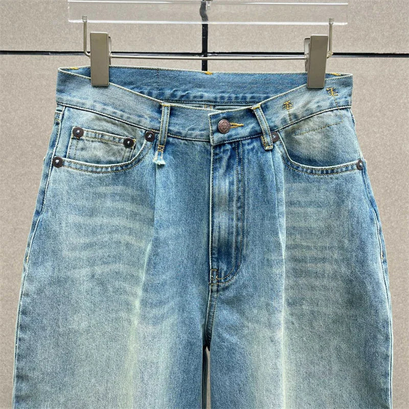 Y2K style high-waisted jeans in light blue denim with zipper closure and wide legs |SuzzaneMarket