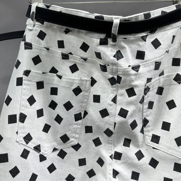 Back view of high-waisted printed jeans with black square patterns | SuzzaneMarket