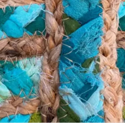 Close-up of Indian jute basket texture, showcasing colorful fabric and braided jute weaving.