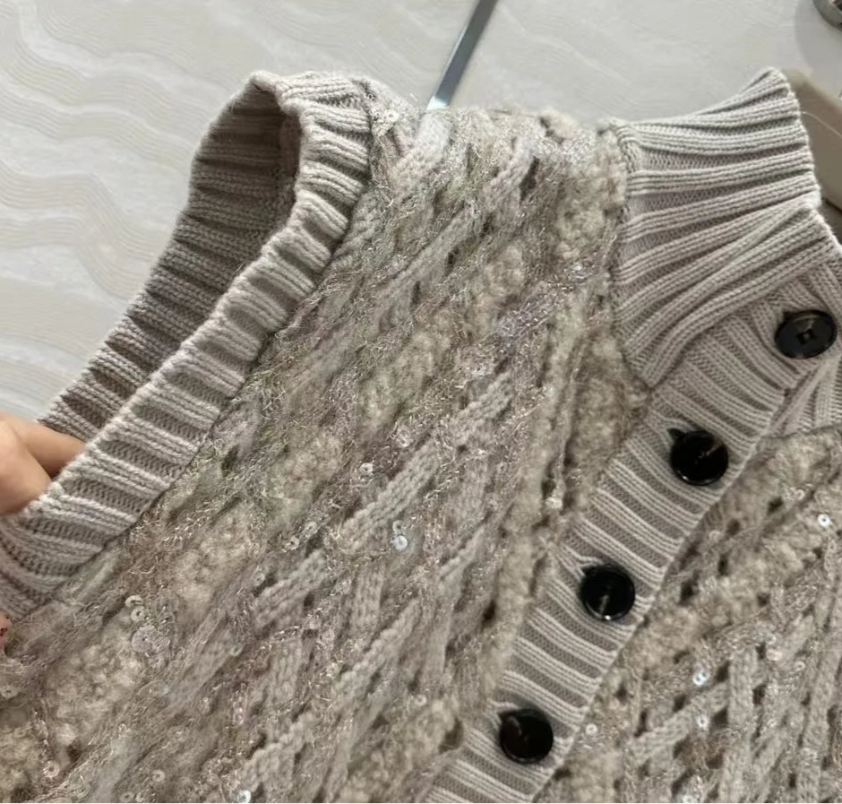 Close-up of beige cashmere knit gilet with sequins and button detail | SuzzaneMarket