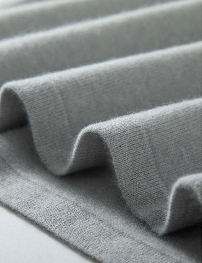 Textured detail of soft grey cashmere fabric, ideal for a loose spring sweater | SuzzaneMarket