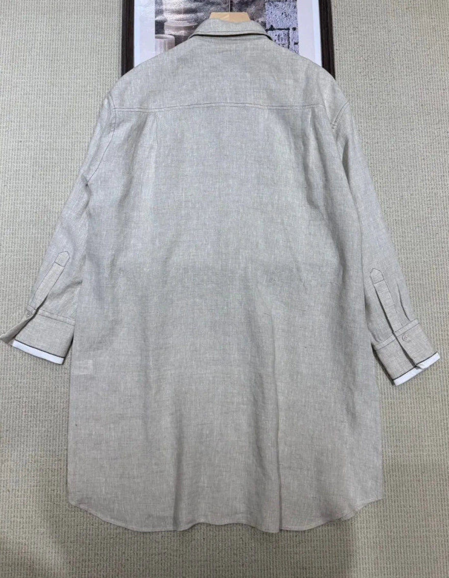 Back view of loose-fit linen shirt dress designed in Korea, featuring long sleeves and knee-length hem | SuzzaneMarket