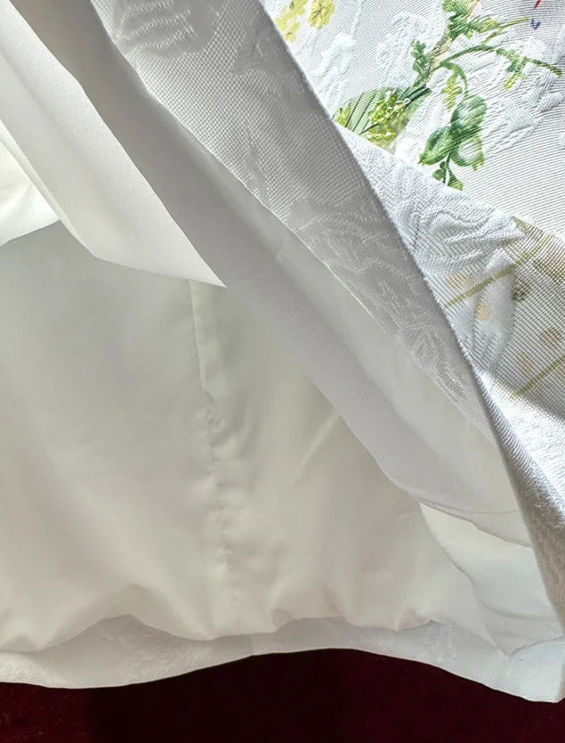 Inside view of the embroidered Dana dress, showcasing its elegant lining and exquisite details. | SuzzaneMarket