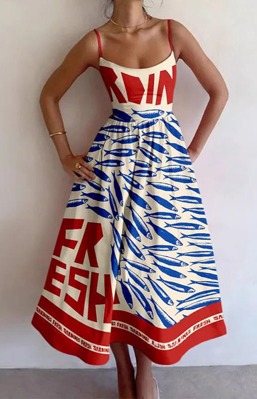 Stylish beach dress with red and blue print, featuring a fitted bodice and flowy skirt. Ideal for summer wear | SuzzaneMarket