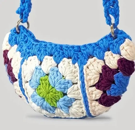 Colorful crochet crossbody bag featuring a floral design and adjustable strap, perfect for casual outings.