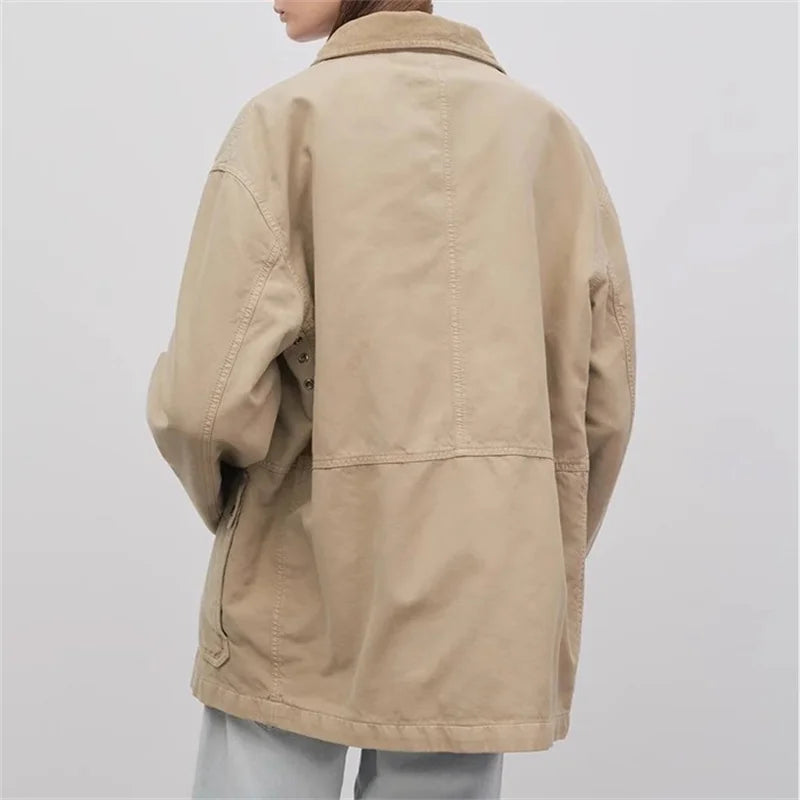Back view of a beige trench court jacket with a collar, showcased on a model. | SuzzaneMarket