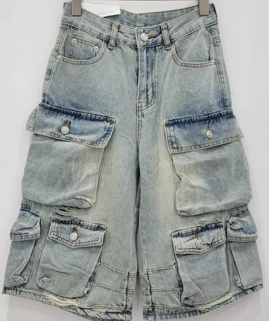 Bermuda Cargo Denim in faded blue, multi-pocket design, high waist, wide fit, zipper closure | SuzzaneMarket