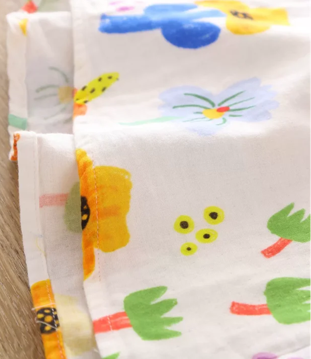 Close-up of colorful floral print fabric used in Chemise Coton Lin - BOGI - features vibrant flowers |SuzzaneMarket