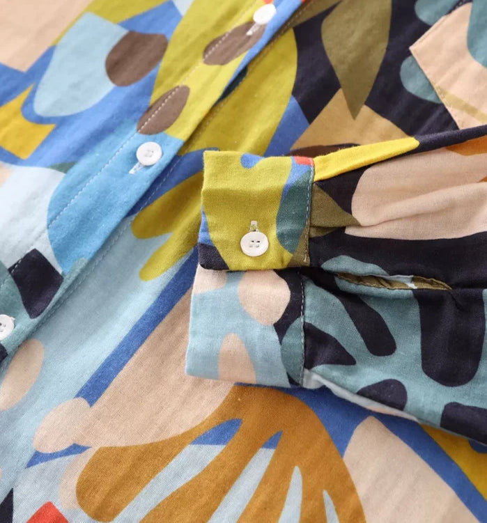 Close-up of Chemise Coton Batik - POPI - featuring colorful patterns and button details. | SuzzaneMarket