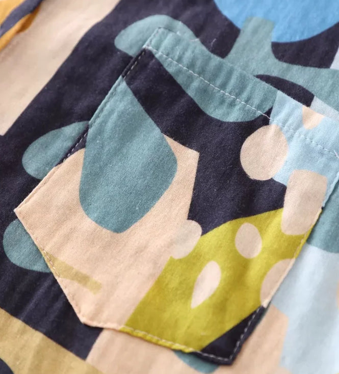 Close-up of Chemise Coton Batik showing colorful patterns and pocket detail |SuzzaneMarket