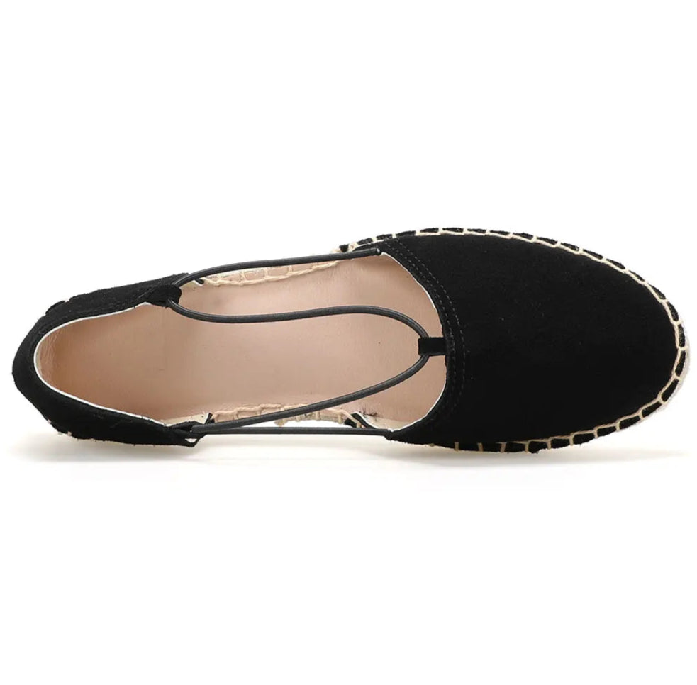 Top view of black suede espadrilles with elastic straps, featuring a woven jute sole | SuzzaneMarket