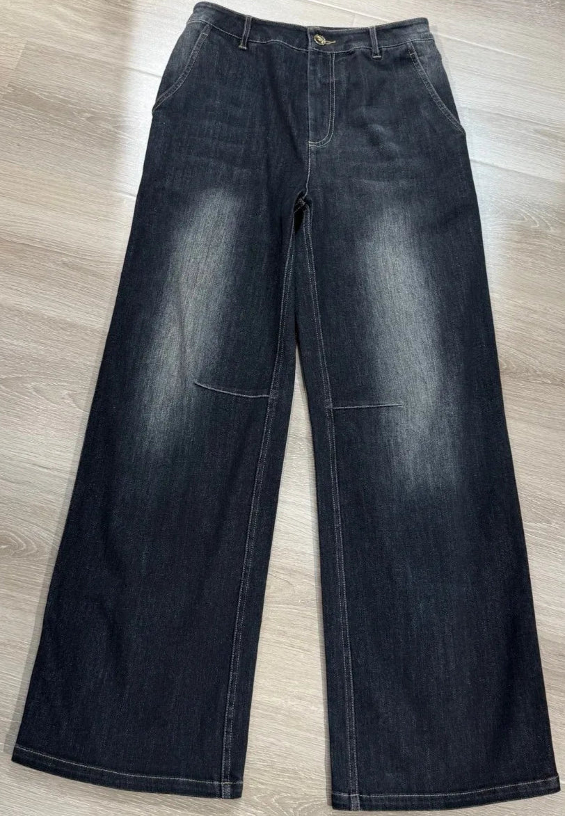Flared denim jeans in dark wash with high waist, knee stitching, and slight stretch | SuzzaneMarket