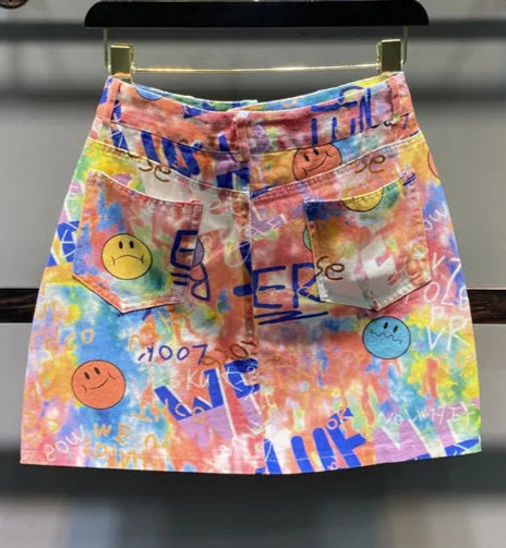 Colorful short denim skirt with smiley face prints and pockets | SuzzaneMarket