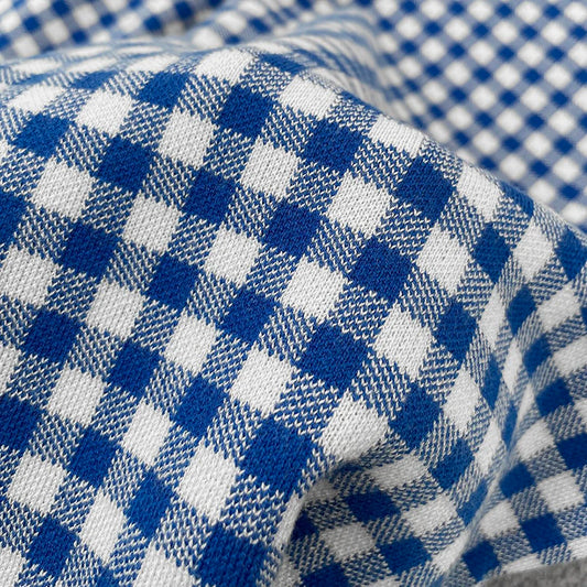 Illustration of blue and white checkered fabric texture, ideal for stylish clothing | SuzzaneMarket