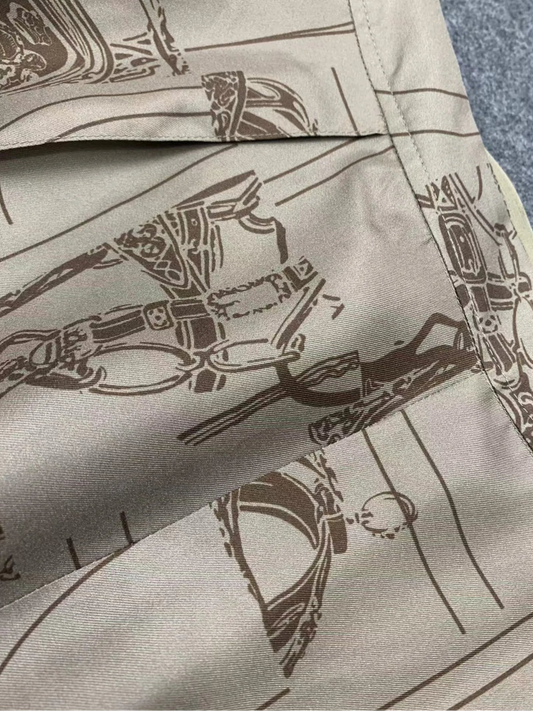 Detail of Pantalon Large Soie in beige, featuring unique print design and elegant fabric texture | SuzzaneMarket