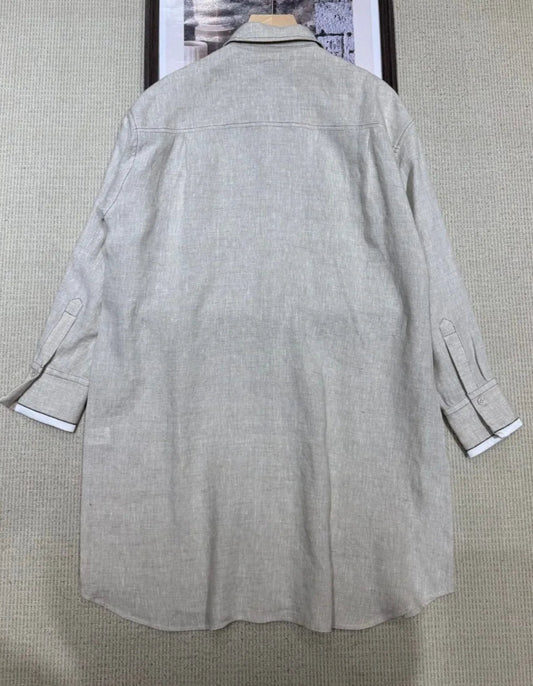 Back view of loose-fit linen shirt dress designed in Korea, featuring long sleeves and knee-length hem | SuzzaneMarket