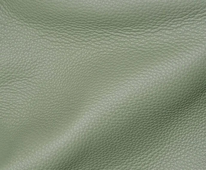 Cuir grainé de couleur verte pour sacs à dos CAMPER - Suzzanemarket - Textures et détails de haute qualité.