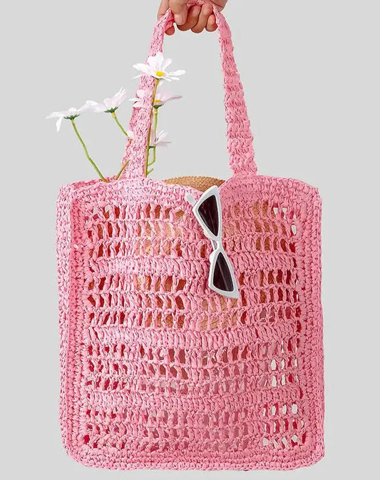 Grand sac en paille tressée rose, non doublé, ouvert, avec anses, idéal pour l'été.
