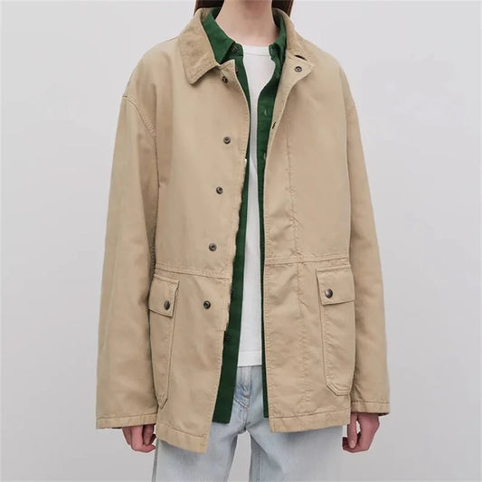 Trench court beige with green shirt underneath, featuring snap button closure and relaxed fit | SuzzaneMarket