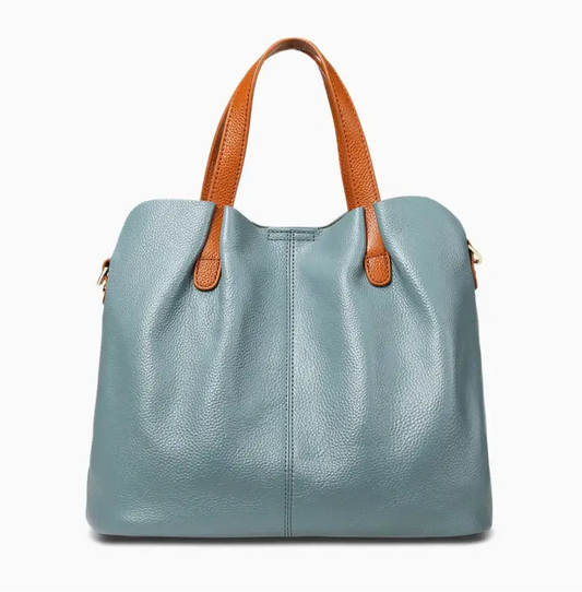 Sac shopping en cuir grainé bleu clair avec anses en cuir marron, grande capacité et design élégant.