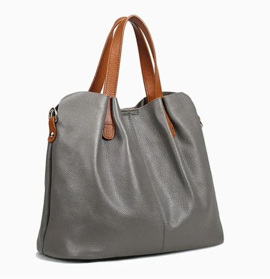 Sac shopping en cuir grainé gris avec anses en cuir cognac, grande capacité et design moderne.