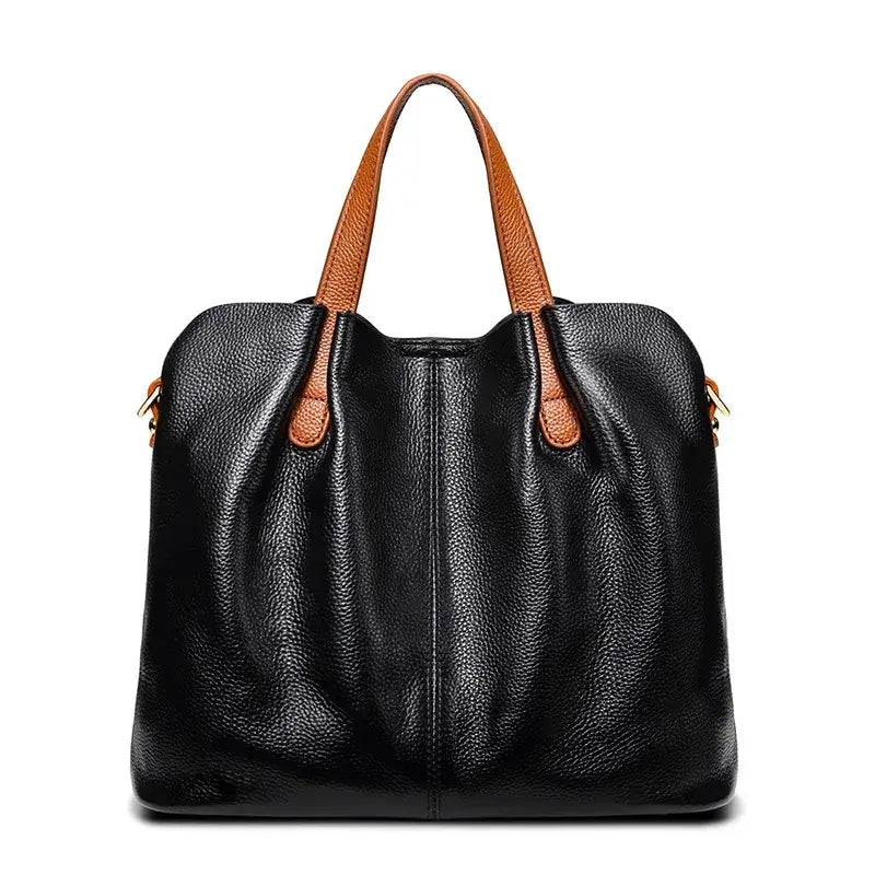 Sac shopping en cuir grainé noir avec anses en cuir caramel, grande capacité et style élégant, parfait pour toutes les occasions.