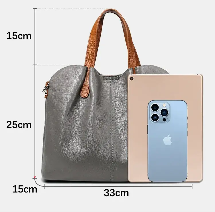 Elegant gray grain leather shopping bag with double handles, dimensions 33x25x15cm, with an iPad for size comparison.