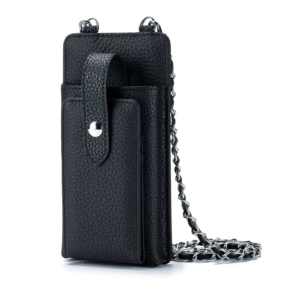 Pochette Téléphone Cuir CYLA en noir, cuir grainé, bride d'épaule chaîne et plusieurs poches pour téléphone et cartes.