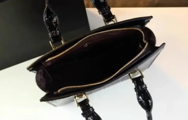 Interior view of the Sac Tote Cuir Croco bag by DOXIE, showcasing pockets and zippers. Available at SuzzaneMarket.