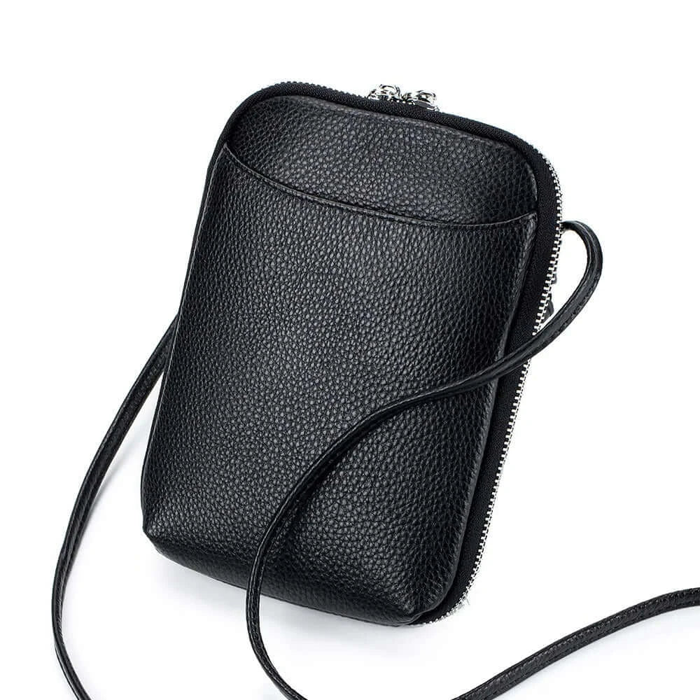 Sac pochette cuir grainé noir avec double zipper et longue bride d'épaule, parfait pour l'essentiel.